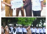 Bupati Kampar Pimpin Apel Bersama ASN dan PPPK Sekaligus Penyerahan Santunan BPJS Ketenagakerjaan