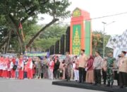 Bupati Ade Lepas Lomba Gerak Jalan Tingkat SD dan SMP, Semarak HUT ke 80 RI 